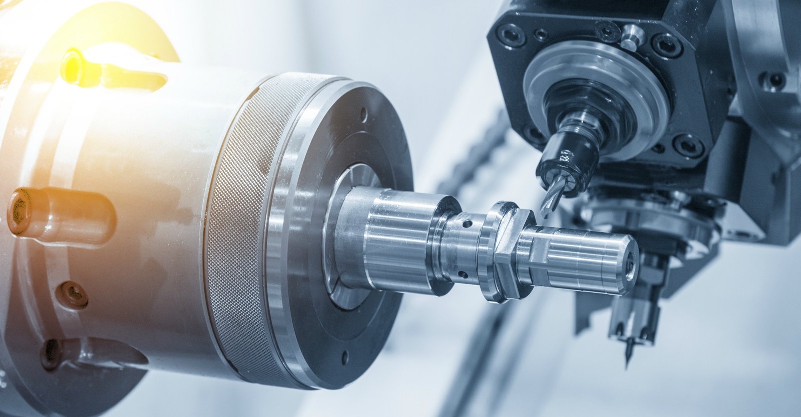 The CNC lathe machine or Turning machine drilling the metal rod with the drill tool and center drill tool .The hi-technology machining concept.